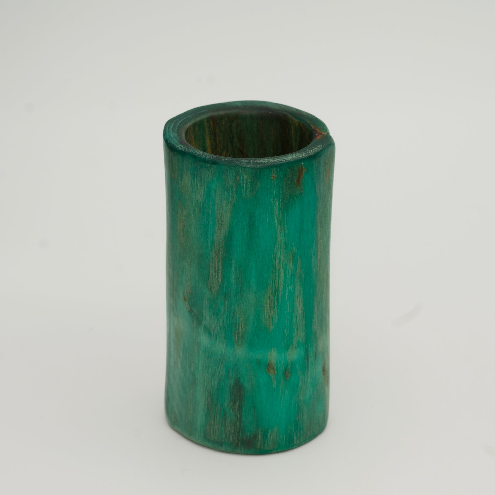 Green plains cottonwood shot glass on white background