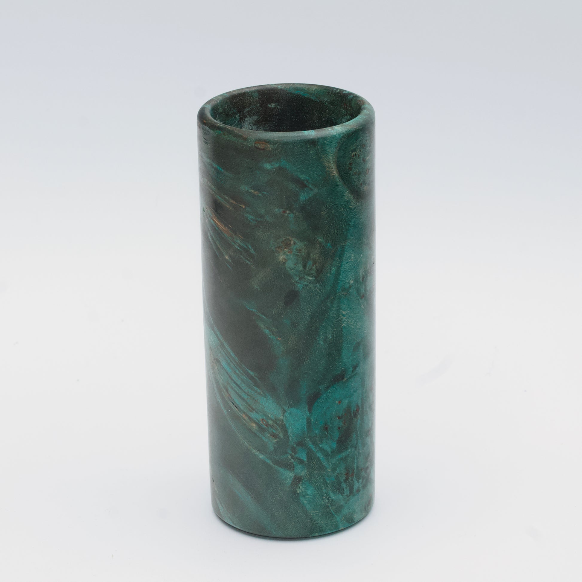 Teal Mapa Burl wood shot glass against white background