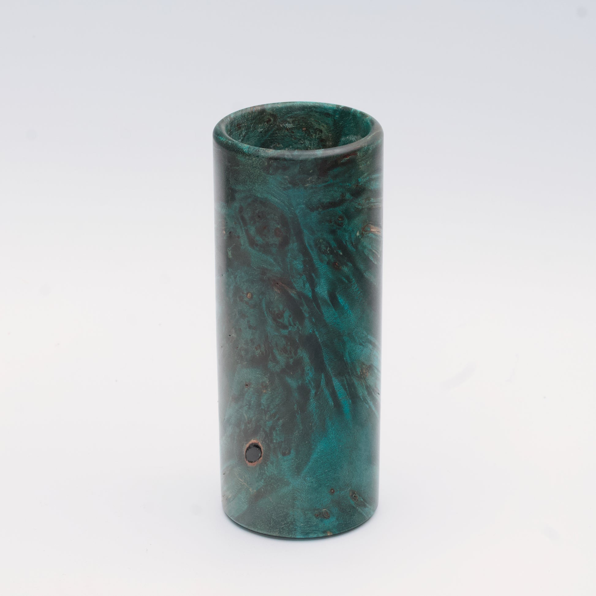 Teal Mapa Burl wood shot glass against white background
