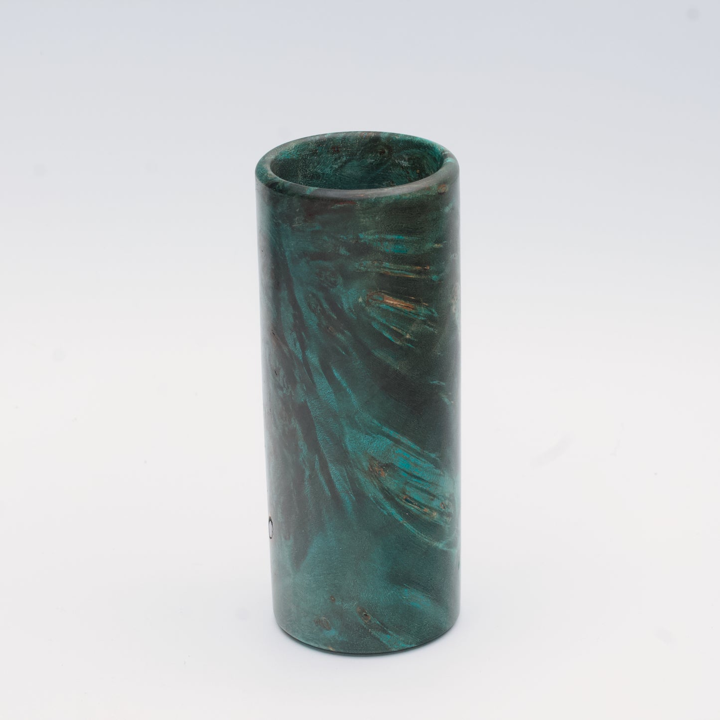 Teal Mapa Burl wood shot glass against white background