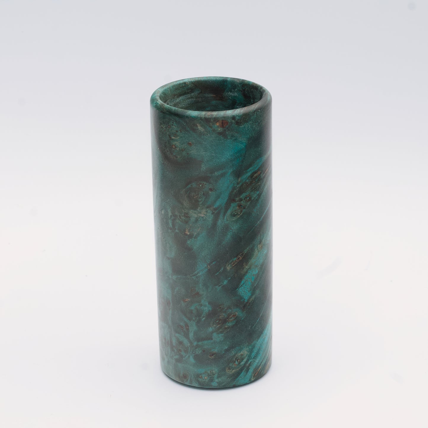 Teal Mapa Burl wood shot glass against white background