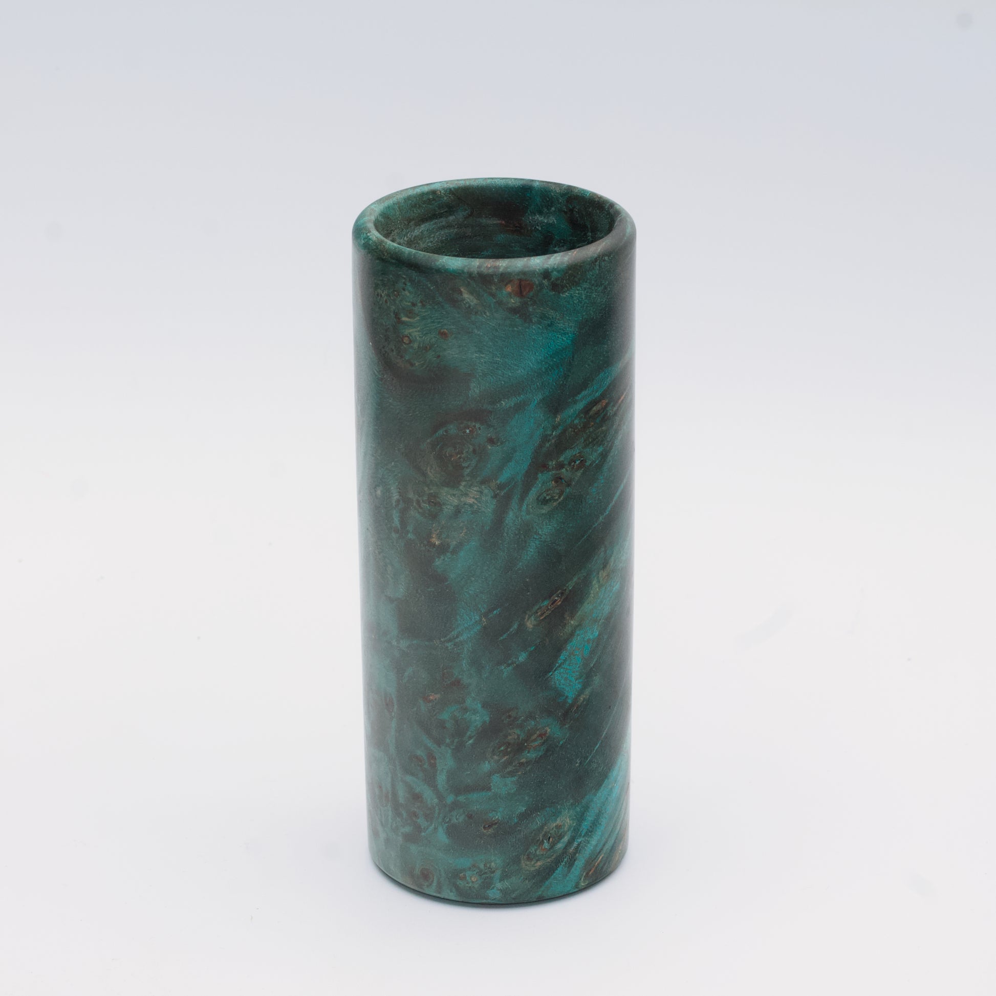 Teal Mapa Burl wood shot glass against white background