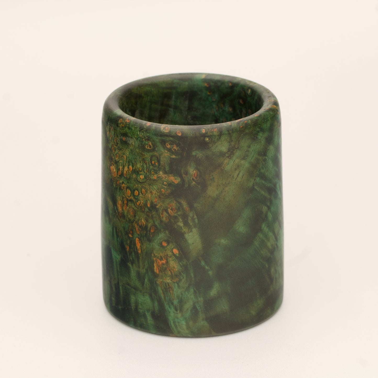 Green river tamarind burl wood shot glass against white background