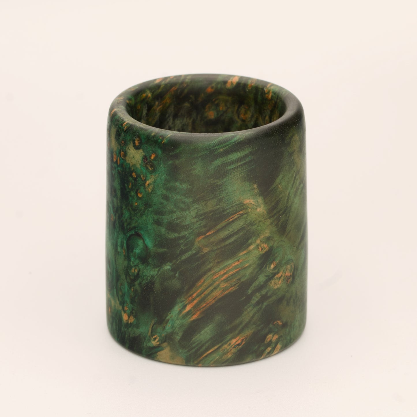 Green river tamarind burl wood shot glass against white background