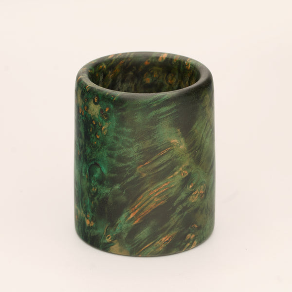 Green river tamarind burl wood shot glass against white background