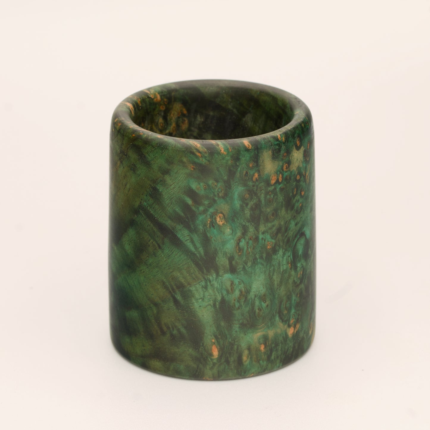 Green river tamarind burl wood shot glass against white background