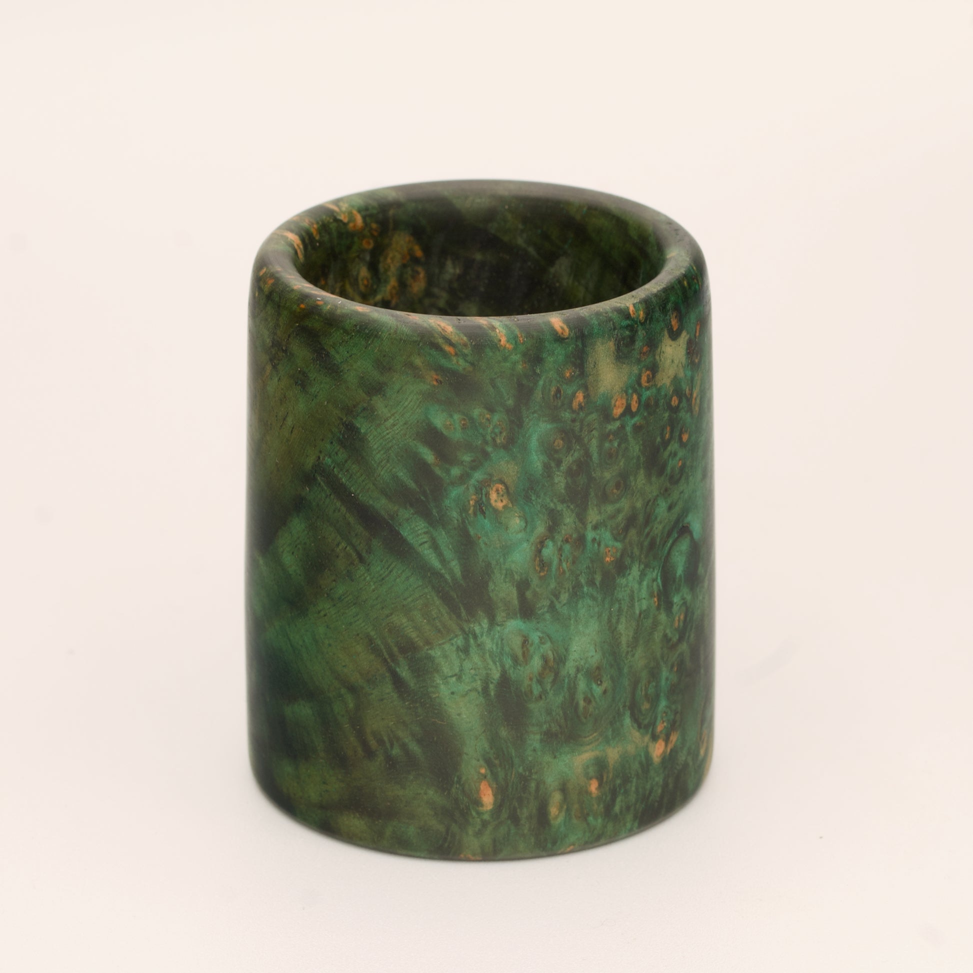 Green river tamarind burl wood shot glass against white background