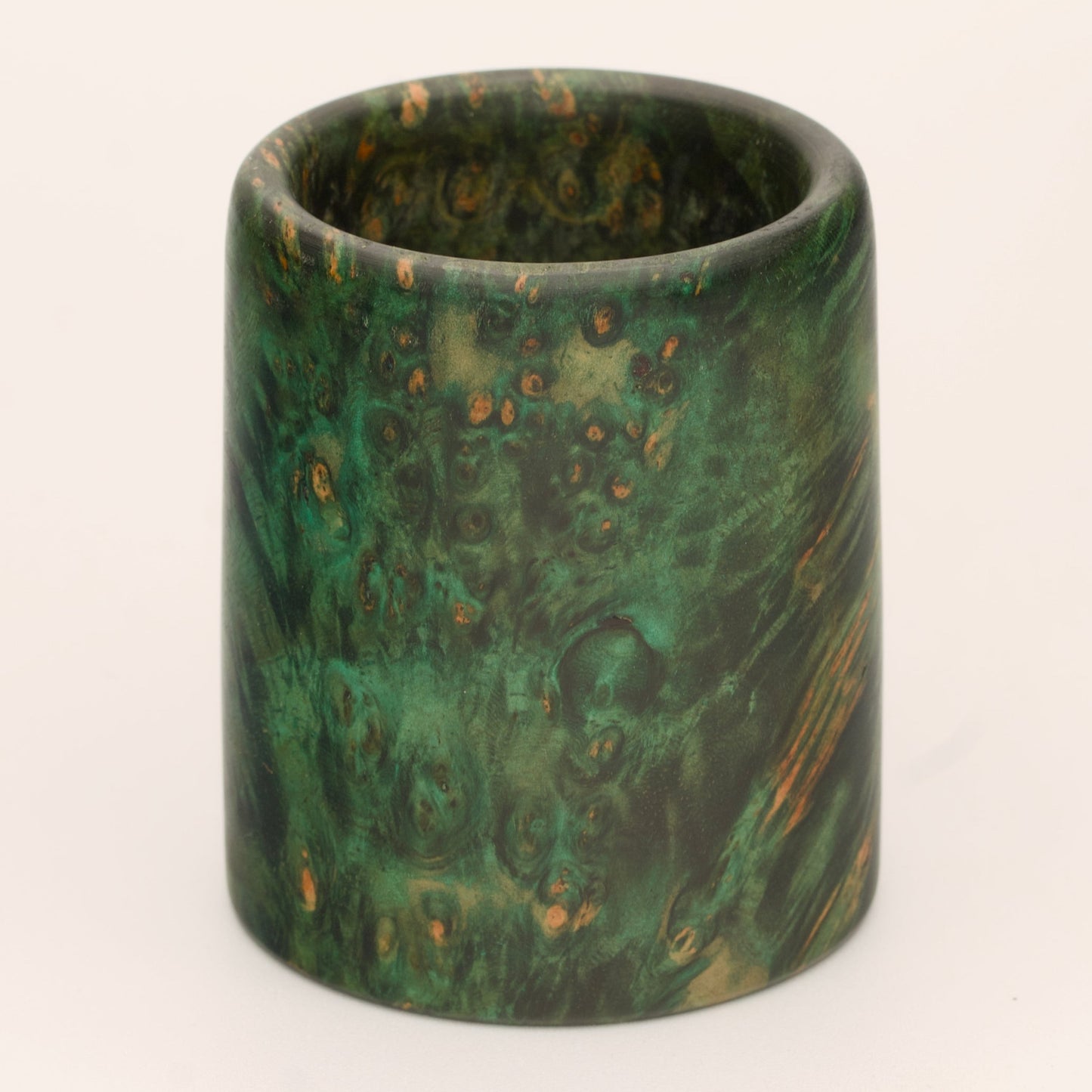Green river tamarind burl wood shot glass against white background