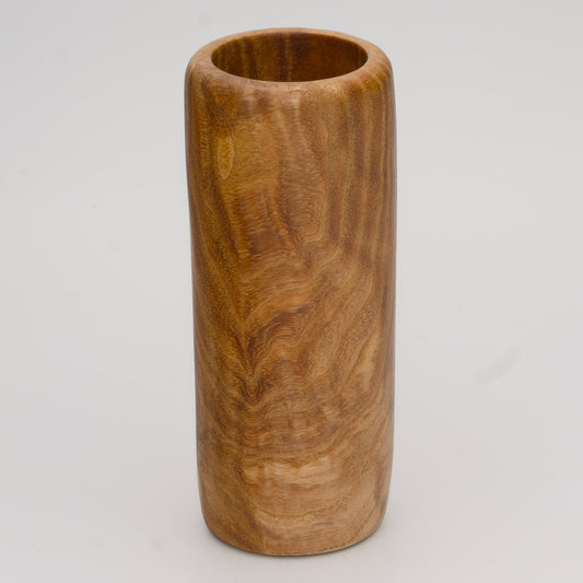 Figured Ash wood shot glass against white background