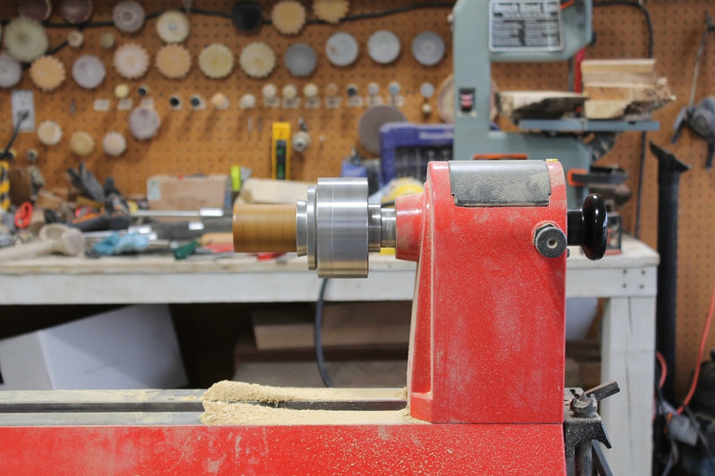 mango shot glass spinning on a red lathe