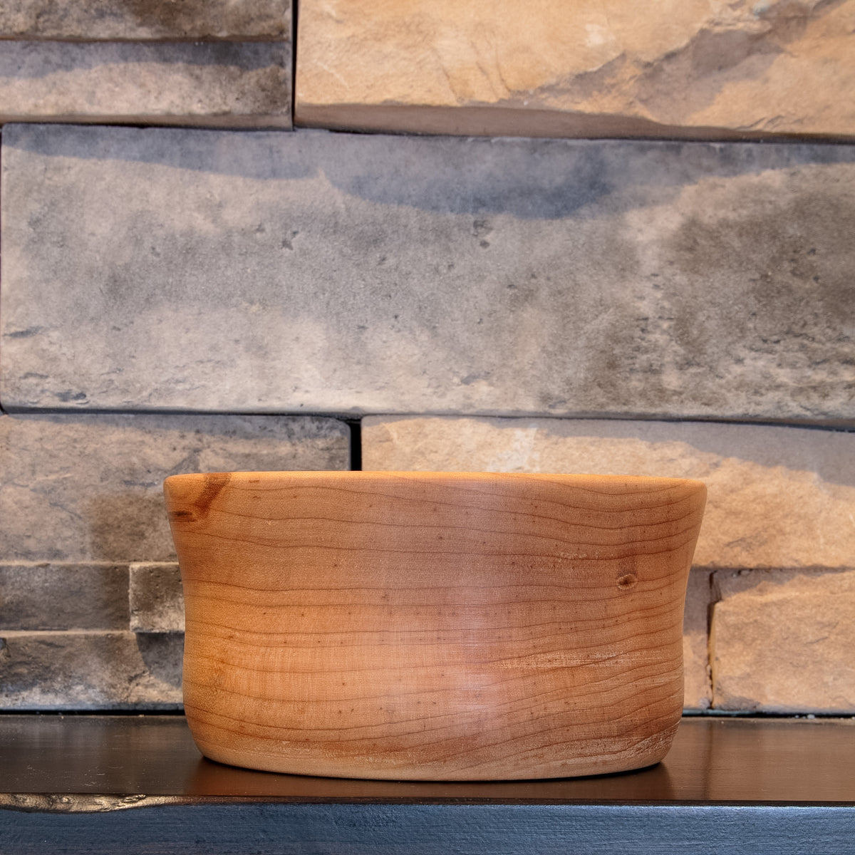 The Final Pass Maple bowl showing the full rounded profile with flowing warm grain and a small natural knot