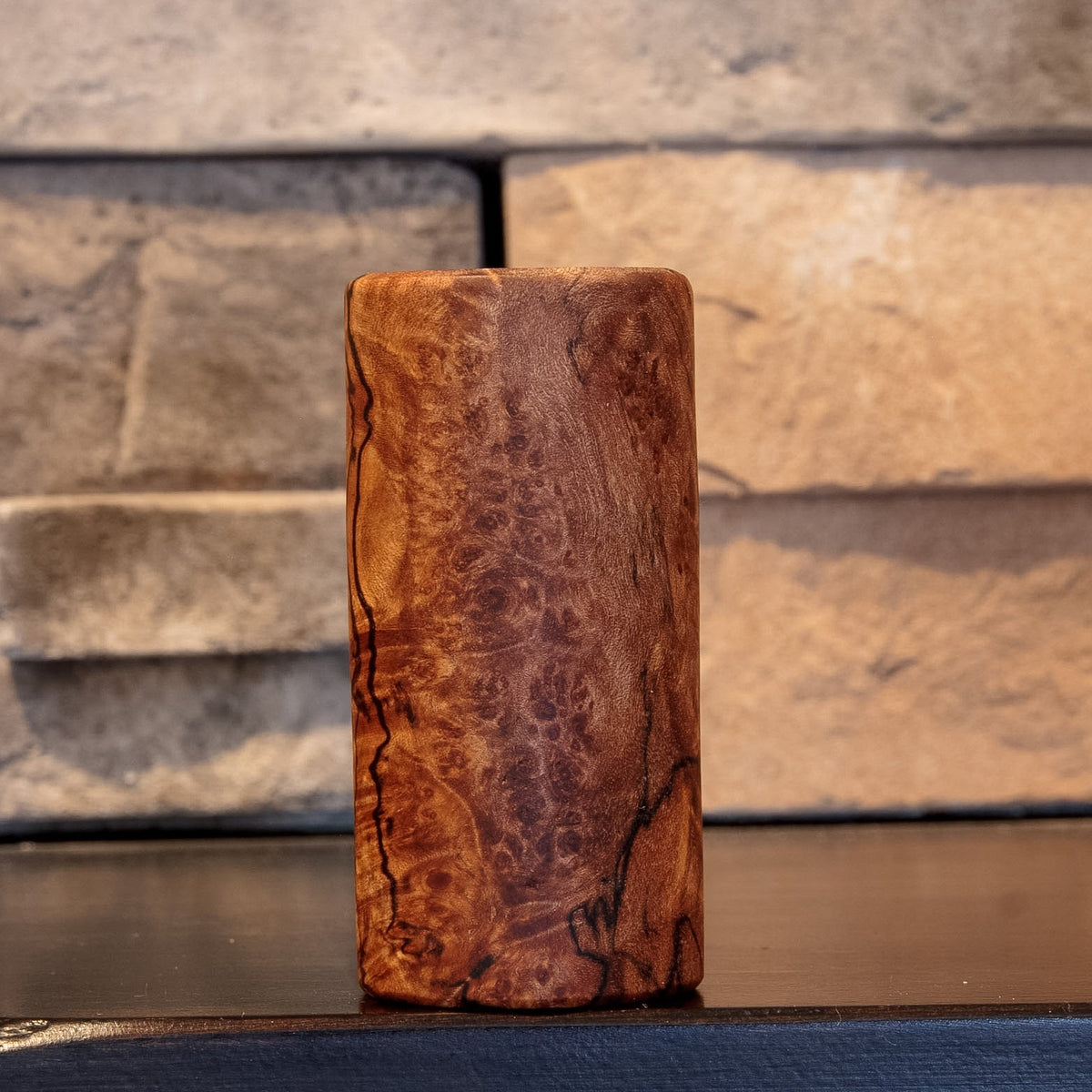 The Long Game showing dense rounded burl figure across a warm amber-brown face