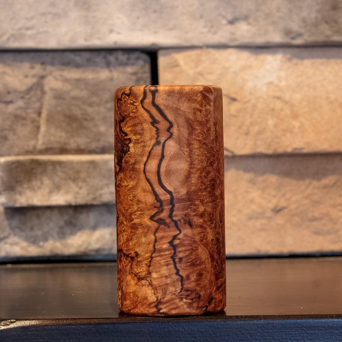The Long Game Bigleaf Maple Burl shot glass with bold dark spalting through warm amber burl figure