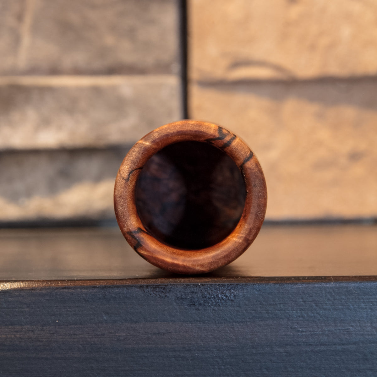 Opening view of The Long Game showing the rounded figured rim and dark traditional shot-glass interior