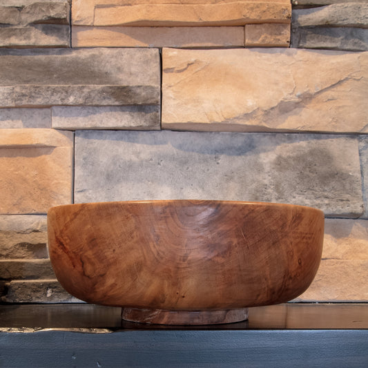 Alternate exterior of The Next Turn Sweetgum bowl showing darker figured grain and prominent natural knot figure