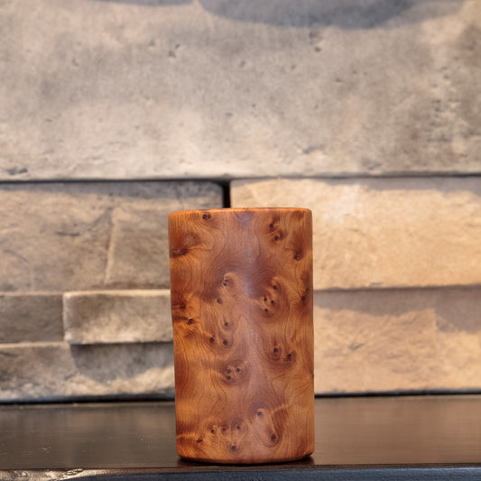 The Scented Testament Thuya Burl shot glass showing dense clustered burl eyes across warm amber grain 
