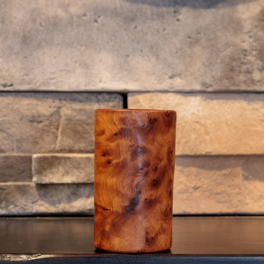 The Scented Testament Thuya Burl shot glass with dark flowing figure through swirling amber burl grain